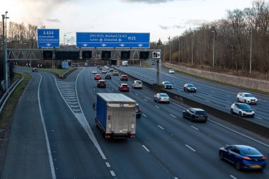Chorleywood, UK - February 25, 2023: British road transport. Evening traffic on busiest British motorway M25