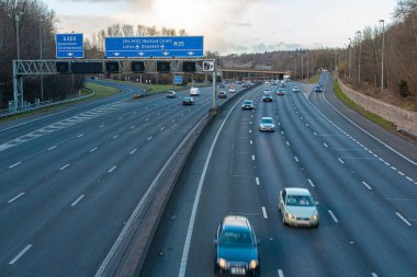 Chorleywood, UK - February 25, 2023: British road transport. Evening traffic on busiest British motorway M25
