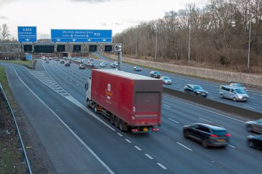 Chorleywood, UK - February 25, 2023: British road transport. Evening traffic on busiest British motorway M25