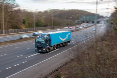 Chorleywood, UK - February 25, 2023:  Amazon Prime lorry in motion on the British motorway M25