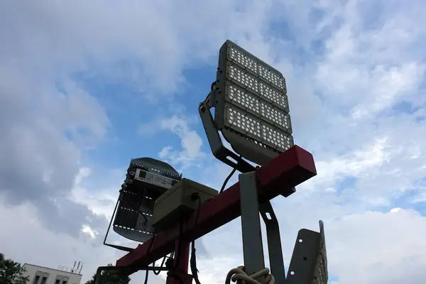 Close up of mobile led flood lights with generator during night time.