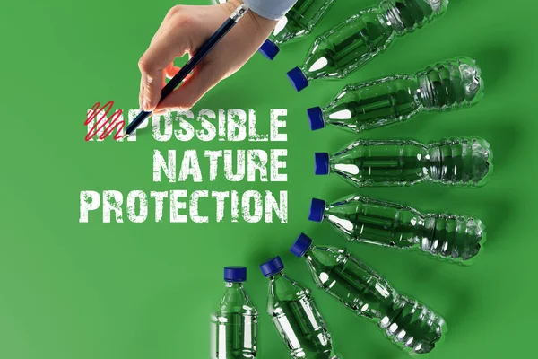 Plastic bottles with the recycling icon and painted recycling arrows and the word recycling. Concept of nature and environment protection. Plastic recycling.