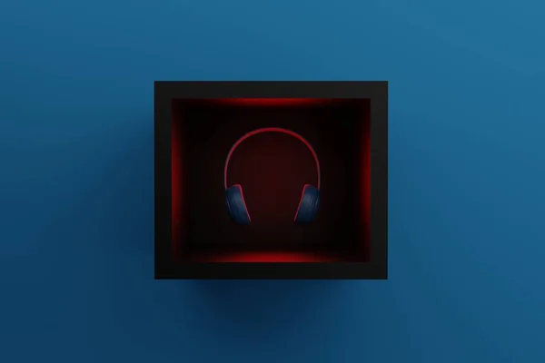 Çerçevedeki Kulaklıklar Mavi Arka Plandaki Kırmızı Işıkla Aydınlatılmış Müzik Kulaklığı — Stok fotoğraf