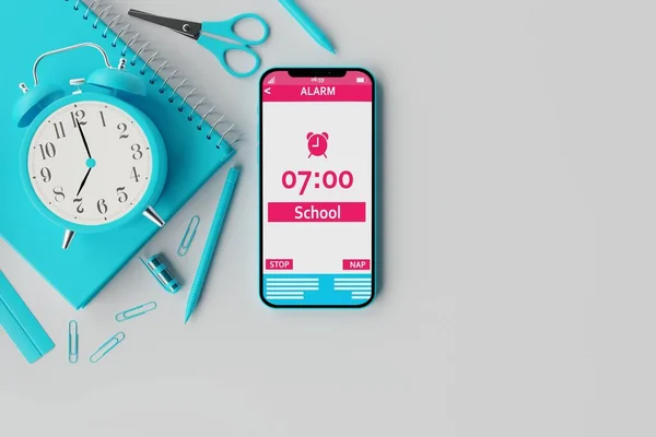 A telephone with an alarm clock on the background of school supplies and a light background. Concept of getting up to school in the morning, back to school. 3d rendering, 3d illustration.
