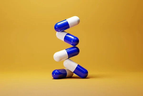 錠剤オレンジの背景に青いカプセル 医薬品の概念 病気の人を治療し 患者の世話をする 3Dレンダリング 3Dイラスト — ストック写真