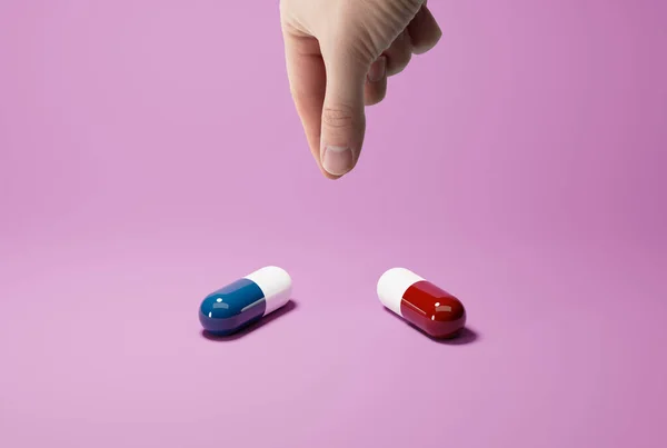 Hand Chooses Blue Red Capsule Concept Imagining Important Most Important — Stock Photo, Image