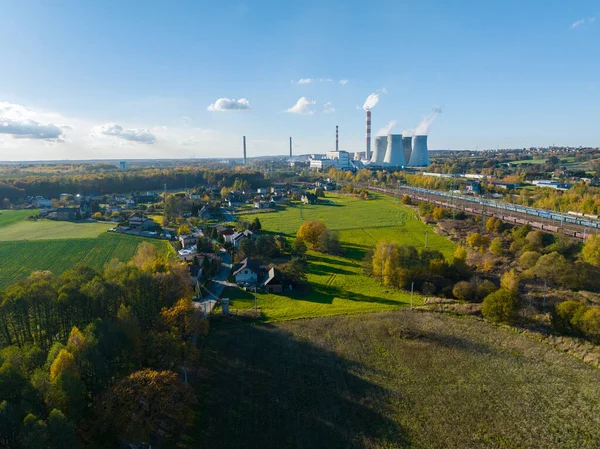 A power plant with huge chimneys, a view from the drone, from the air. Electricity creation concept. Great coal power plant, environment and environmental protection.