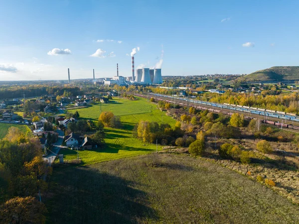 A power plant with huge chimneys, a view from the drone, from the air. Electricity creation concept. Great coal power plant, environment and environmental protection.