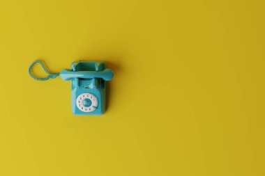 Top view of turquoise retro telephone with dial of numbers. Concept of using retro items, back to the past. 3d render, 3d illustration
