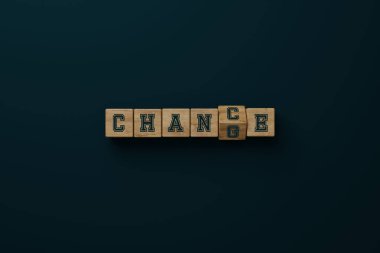 Wooden blocks with the word CHANGE changing the letter G to C so that the word CHANCE appears. 3d render