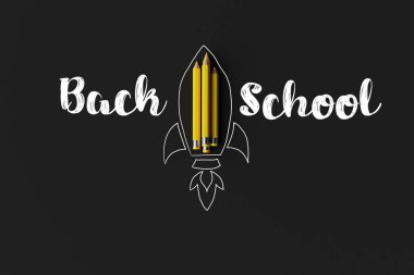 Pencils arranged in the shape of a rocket and outlined with a rocket with the word back to school. Concept for starting school, back to school. 3d rendering, 3d illustration.