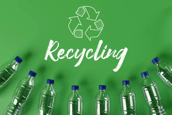 Plastic bottles with the recycling icon and painted recycling arrows and the word recycling. Concept of nature and environment protection. Plastic recycling. 3d render