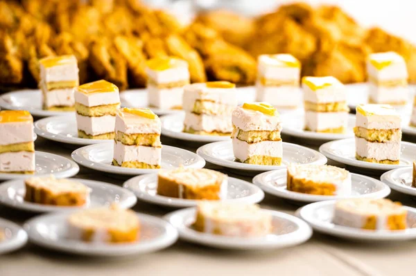 abstract background of many rows of cake dessert plates, selective focus