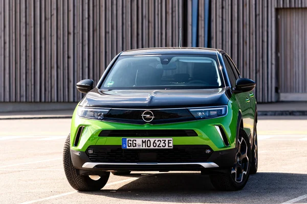 stock image Riga, Latvia - 26 March, 2021: green electric vehicle Opel Mokka-e in the public parking lot, future technologies, modern design