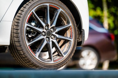 sports car wheels, low profile tires on aluminum rims, close-up, selective focus