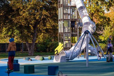 Dobele, Latvia - October 7, 2022: Tunnel and Slider , Colorful Playground for Children in the Park