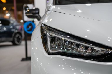 Riga, Letonya, 28 Nisan 2023: LED far ve araba tasarımı Nev Cupra doğumlu elektrikli araç, model 2023