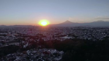 Puebla at Dramatic Evening Sunset aerial drone shot of City Center in Puebla de Zaragoza, Puebla State, Mexico. 4k