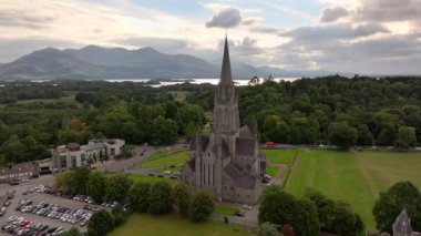Killarney, Ireland, County Kerry - Aerial Drone Shot in Cloudy day of St. Mary Cathedral in Late Irish Summer. High quality 4k footage