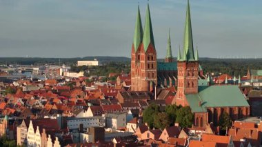 Lubeck city Aerial shot. Saint Marie and saint peter churches, Holstentor Gothic gate, Schleswig-Holstein land, Germany. High quality 4k footage