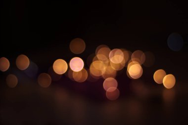 Blurred image of bokeh lights on the black background.
