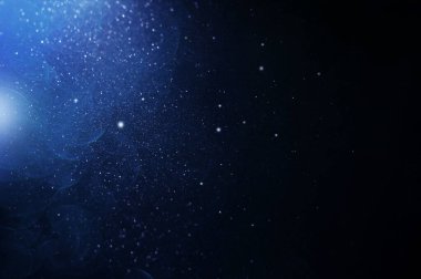 Metin için alanı olan soyut mavi parçacık tozu arkaplanı