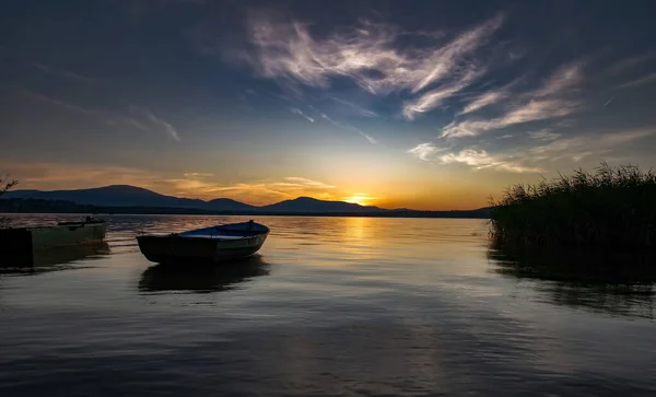 stock image Sunset at the lake with reflection in the water.