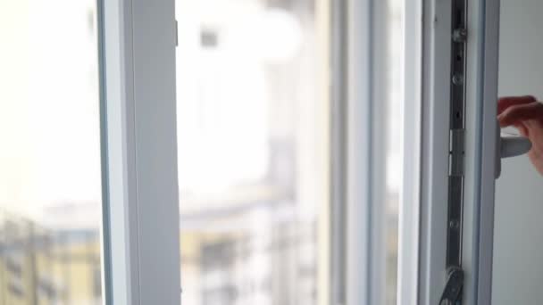 Man Closes White Plastic Pvc Side Hung Inward Window — Wideo stockowe