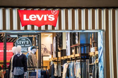 Levis Jeans store entrance with logo in a shopping mall. Levi Strauss Is An American Clothing Brand Known Worldwide. Budapest, Hungary - February 3, 2023.