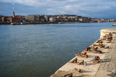 Shoes on the Danube Bank. Memorial to the Hungarian Jews, the victims of the Holocaust, executed along riverbank during WWII. Budapest, Hungary - February 2, 2023.