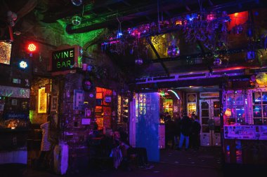 Szimpla Kert, famous ruin pub in Budapest, interior at night. Nightlife, hungarian bars and nightclubs concept. Budapest, Hungary - February 2, 2023.