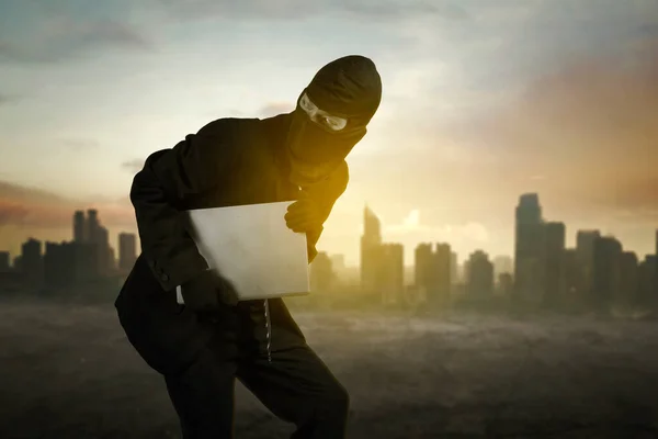 Close Male Thief Wearing Mask While Carrying Laptop Road Silhouette — Stock Photo, Image