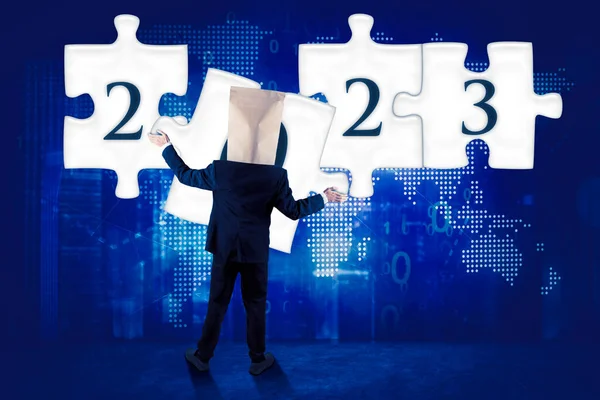 Back View Unknown Businessman Cardboard Head Arranging Puzzle 2023 Numbers — Stock Photo, Image