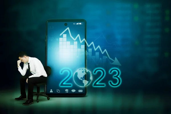 Stressed Businessman Sitting Chair Declining Finance Arrow 2023 Number Cellphone — Stock Photo, Image