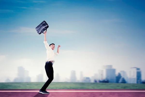Male Entrepreneur Expressing Happy Lifting Briefcase While Dancing Copy Space — Stock Photo, Image