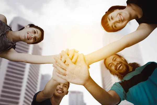 Low Angle View Four Young People Joining Hands Exercising Together — Stock Photo, Image