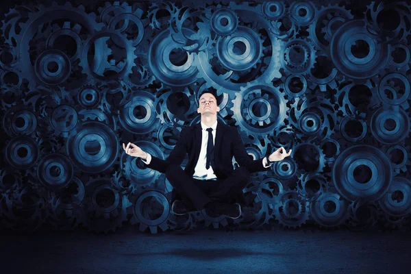 Young Caucasian Businessman Levitating Yoga Position Cog Wheels Background — Stock Photo, Image
