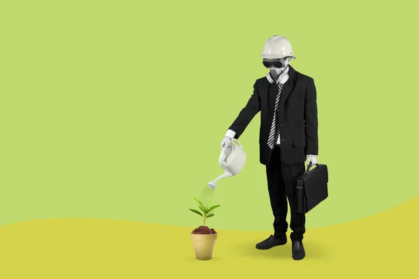 Businessman wearing a gas mask watering plant in pot with can collage in magazine style. Contemporary art. Modern design