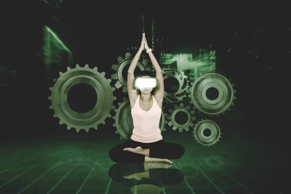 Young Athletic Woman Wearing Virtual Reality Headset, Practising Meditation in Modern Futuristic Way