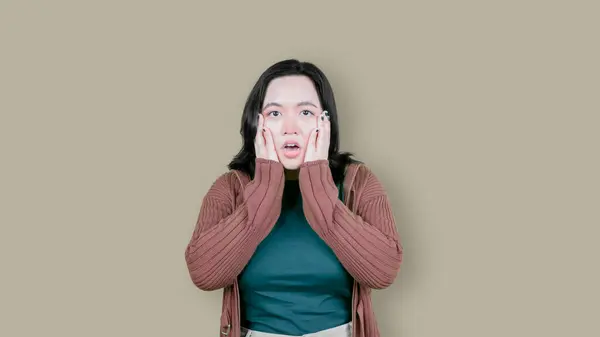 stock image Image of shocked overweight asian woman in panic isolated over brown background