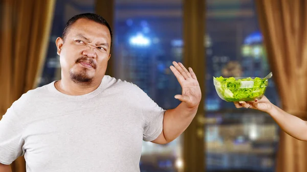 Overweight Asian Guy Refusing Eating Salad Offered His Wife Apartment — Stock Photo, Image
