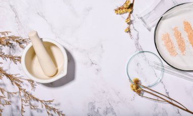 Face powder smear, Shade of natural cosmetics make up, Different tones of organic mineral powder and laboratory glassware.