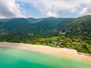 Aerial drone view of bamboo bay and beach at Koh Lanta island, Thailand. Tropical forest near the rocky beach and white sand with turquoise water. clipart