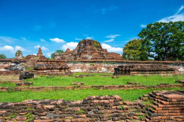 Ruins of ancient city and temples Ayutthaya, Thailand. Old kingdom of Siam. Summer day with blue sky. Famous tourist destination, spiritual place near Bangkok.
