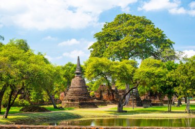 Ruins of ancient city and temples Ayutthaya, Thailand. Old kingdom of Siam. Summer day with blue sky. Famous tourist destination, spiritual place near Bangkok.