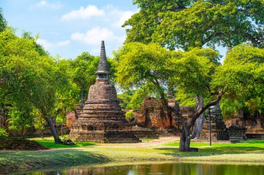 Ruins of ancient city and temples Ayutthaya, Thailand. Old kingdom of Siam. Summer day with blue sky. Famous tourist destination, spiritual place near Bangkok.