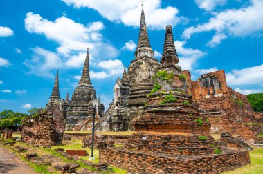 Ruins of ancient city and temples Ayutthaya, Thailand. Old kingdom of Siam. Summer day with blue sky. Famous tourist destination, spiritual place near Bangkok.