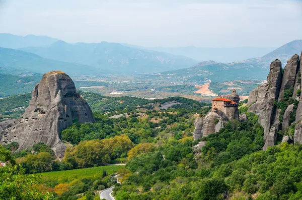 stock image Monastery Meteora Greece. Stunning summer panoramic landscape. View at mountains and green forest against epic blue sky with clouds. UNESCO heritage list object.