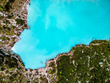 Aerial drone view of beautiful Lake Sorapis, Lago di Sorapis, in Dolomites, popular travel destination in Italy. Blue green lake in Italian Dolomites clipart