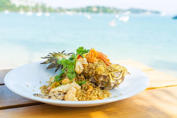 stock image Seafood fried rice in pineapple, appetizing in a cafe next to the sea, Sue Flamingo, Ao Yon Beach, Phuket Thailand